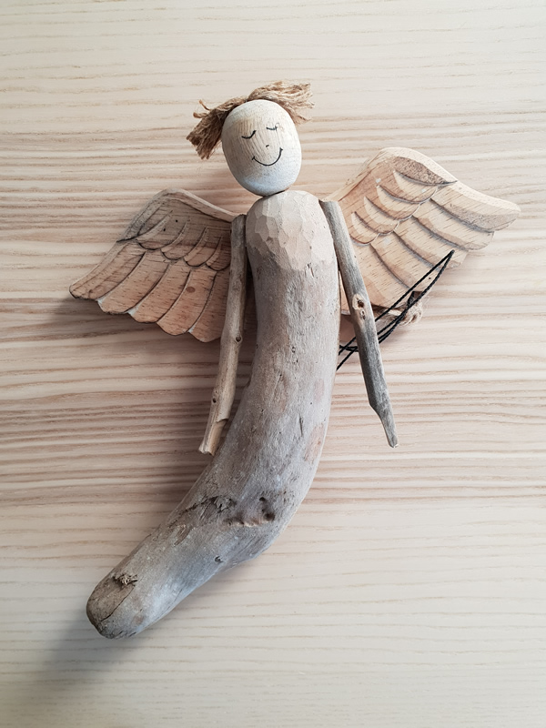 Wooden bali angels craftsmen handmade organic christmas sally bourne interiors london